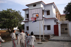 Boarding school student playing basket ball